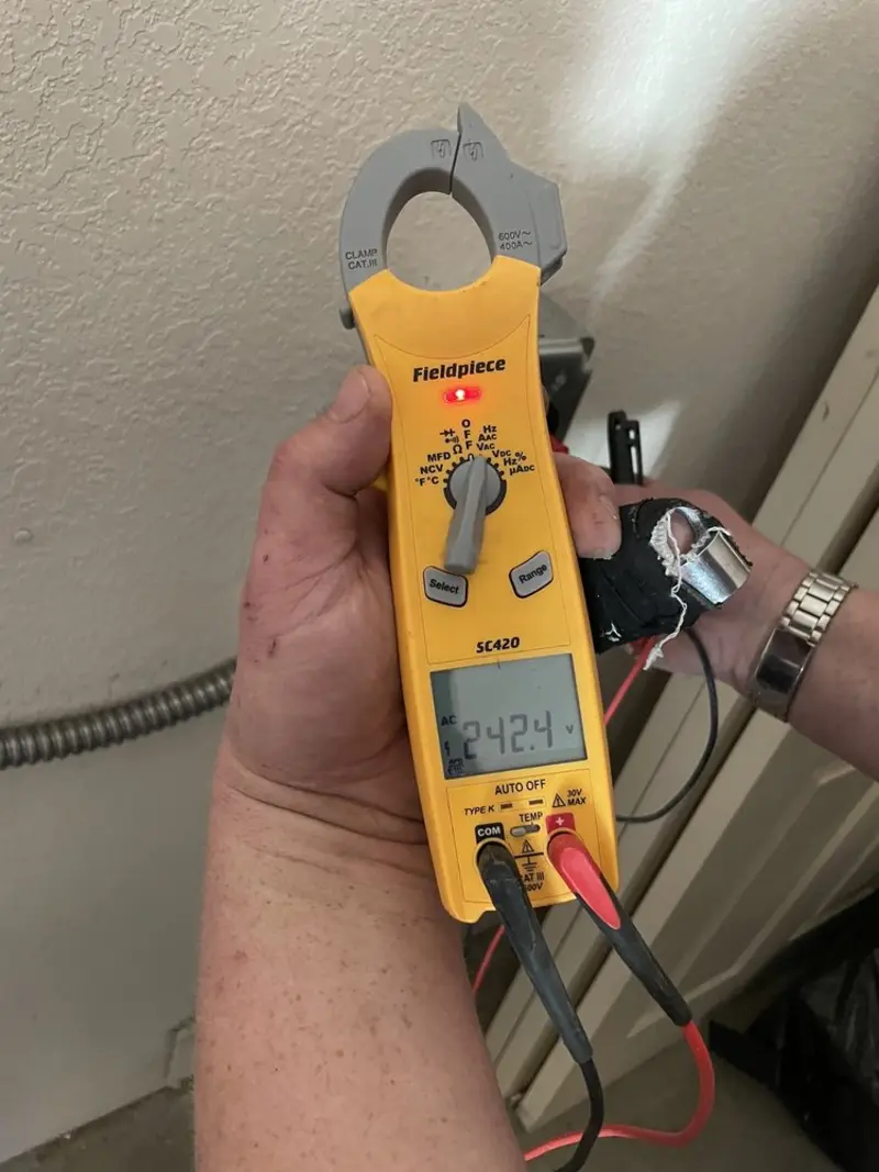 Voltage testing with clamp meter during Electrical Installation Services in Palatka